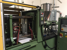Load image into Gallery viewer, Arburg Injection molder running the Cutting Time ruler mold.